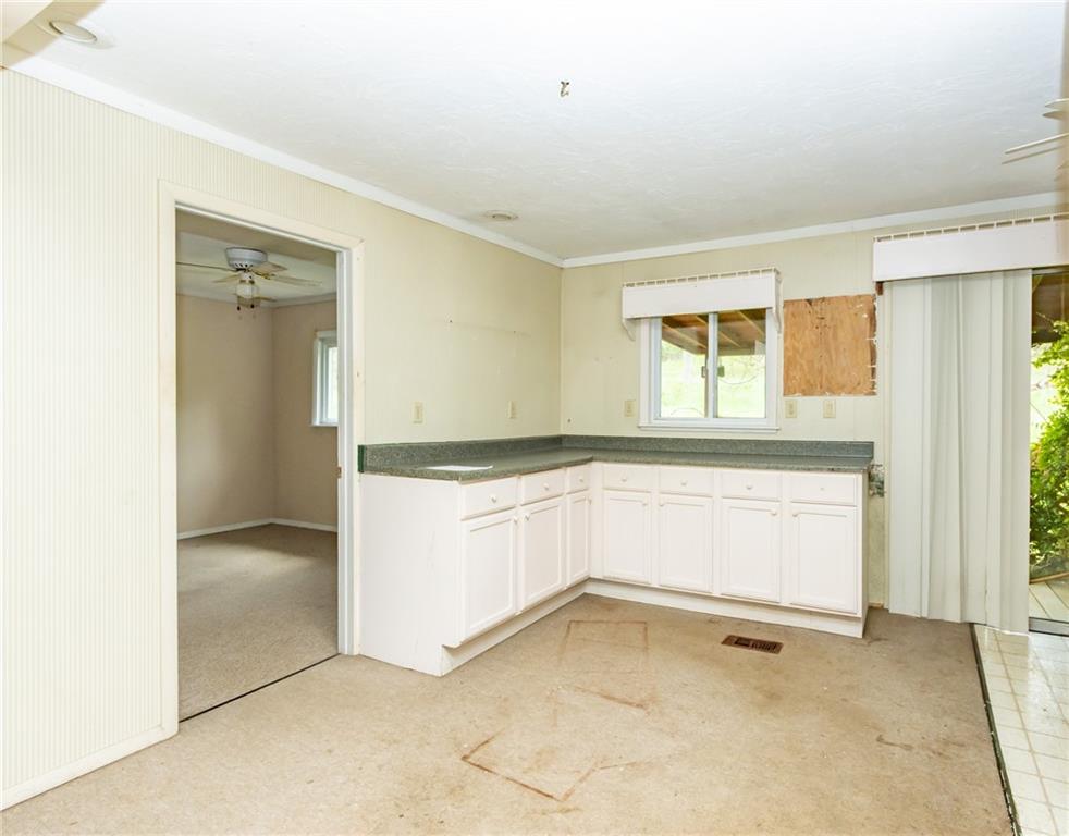 1736 Maple Road New Bethlehem, PA 16242 - Photo 14 of 22 a view of an empty room with window and cabinet