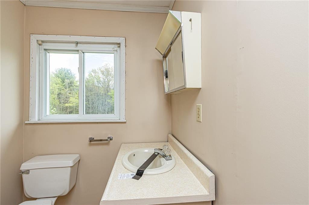 1736 Maple Road New Bethlehem, PA 16242 - Photo 22 of 22 a bathroom with a toilet a sink and a window