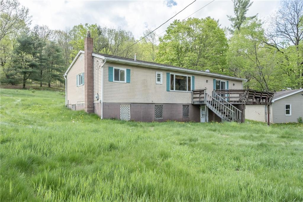 1736 Maple Road New Bethlehem, PA 16242 - Photo 4 of 22 a view of a house with backyard and trees
