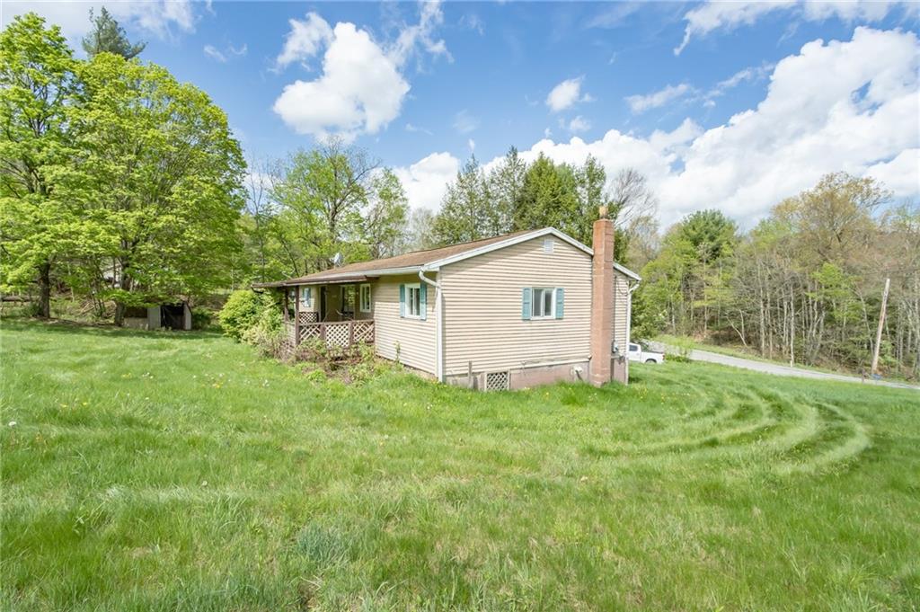 1736 Maple Road New Bethlehem, PA 16242 - Photo 5 of 22 a view of a backyard with a garden