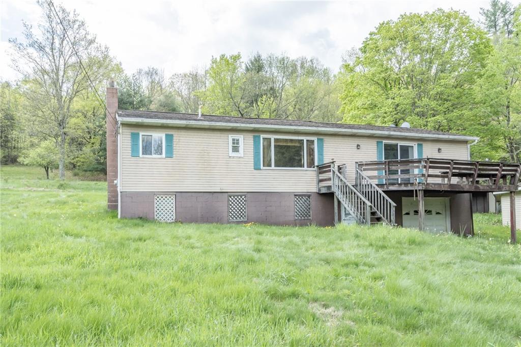 1736 Maple Road New Bethlehem, PA 16242 - Photo 6 of 22 a view of a house with a backyard