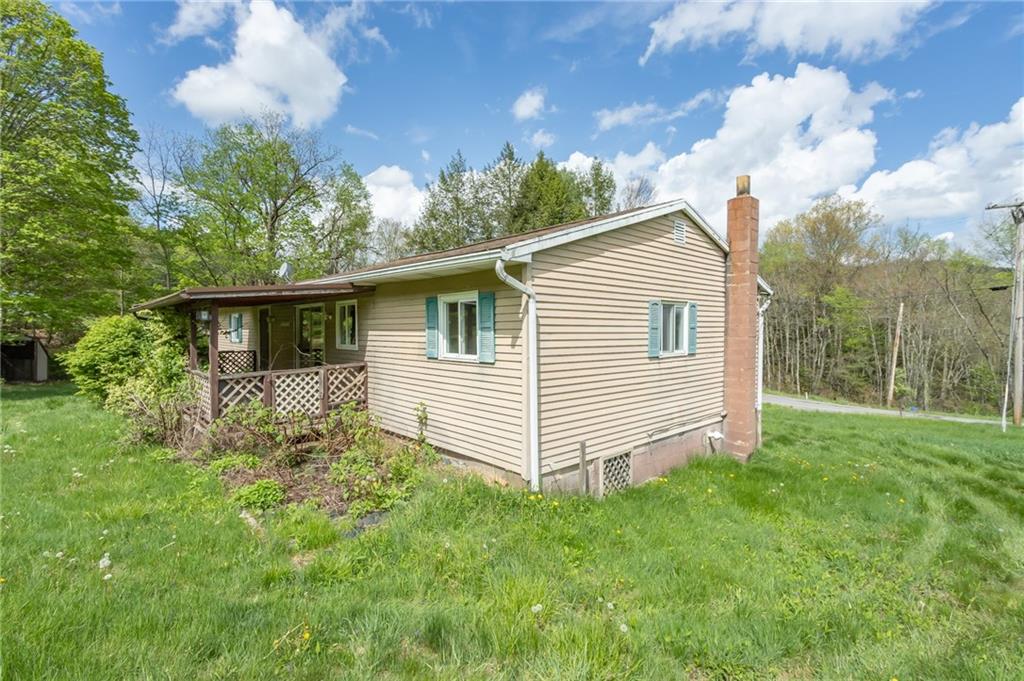 1736 Maple Road New Bethlehem, PA 16242 - Photo 7 of 22 a view of a house with a yard