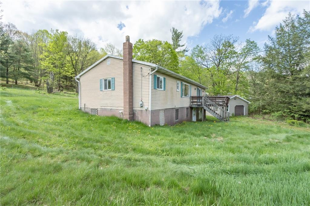 1736 Maple Road New Bethlehem, PA 16242 - Photo 8 of 22 a view of a house with backyard and garden