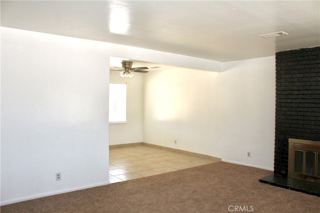 15975 Venango Road Apple Valley, CA 92307 - Photo 2 of 23 Living room with brick fireplace