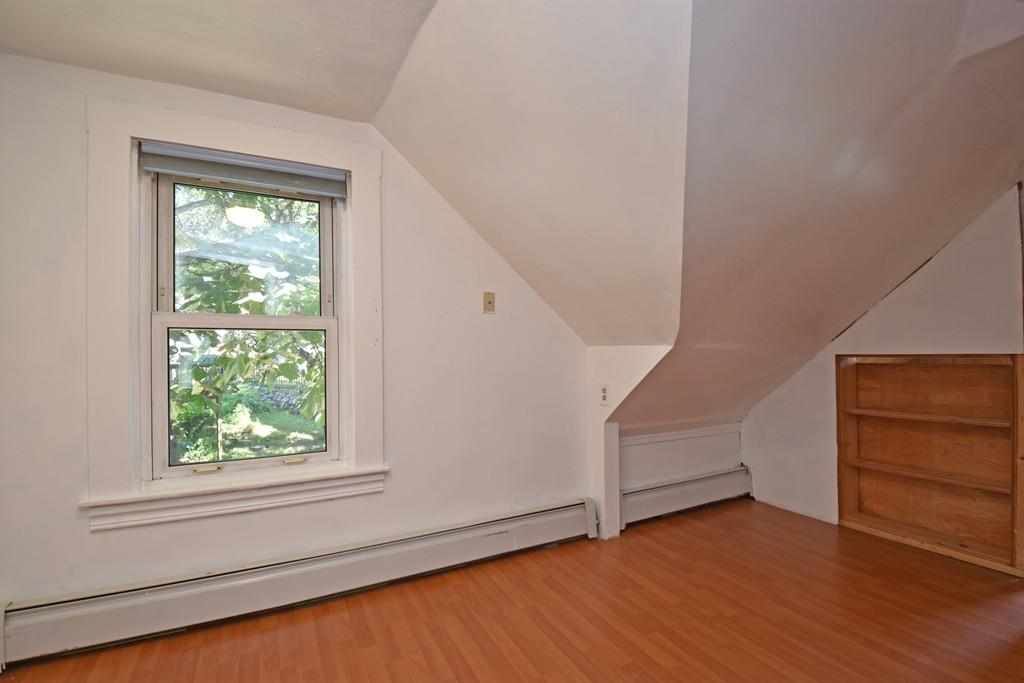 9 Catacunemaug Road Shirley, MA 01464 - Photo 16 of 22 a view of an empty room with wooden floor and windows