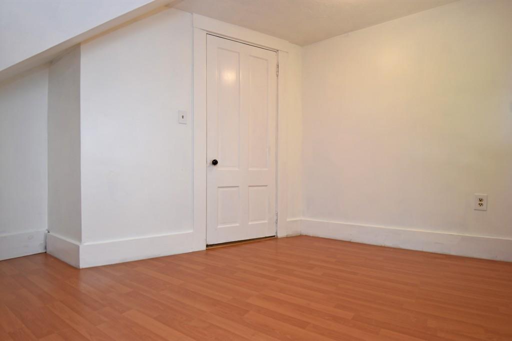 9 Catacunemaug Road Shirley, MA 01464 - Photo 17 of 22 a view of an empty room with wooden floor