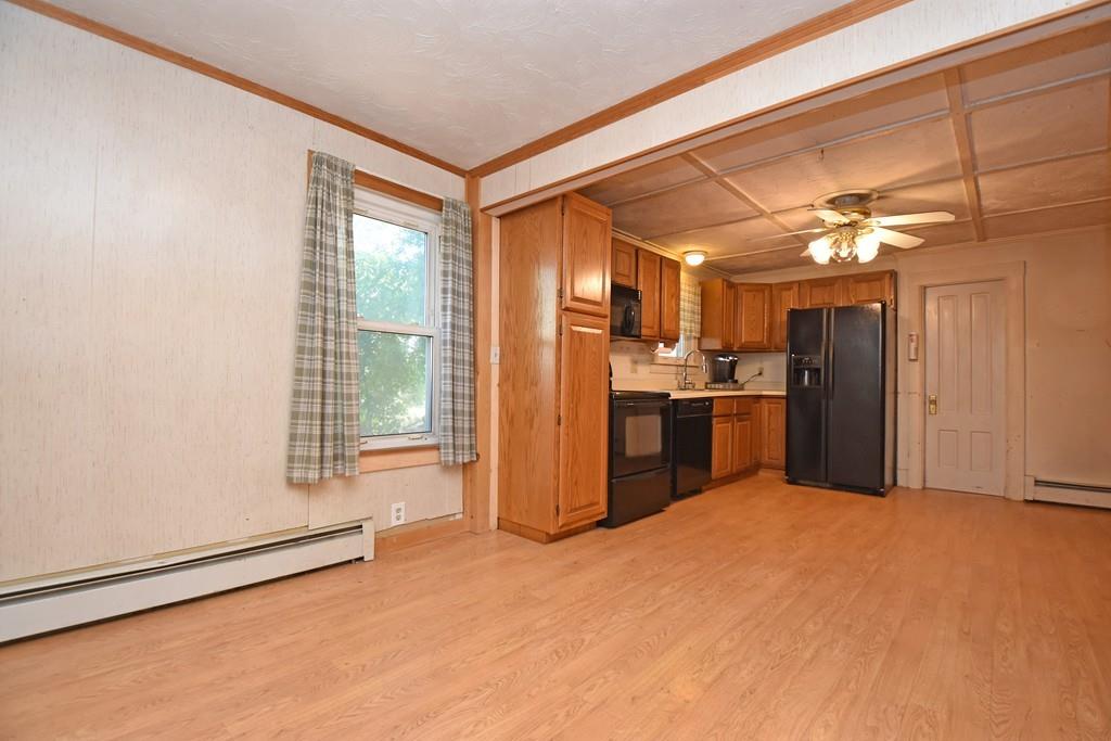 9 Catacunemaug Road Shirley, MA 01464 - Photo 3 of 22 a kitchen with refrigerator and window