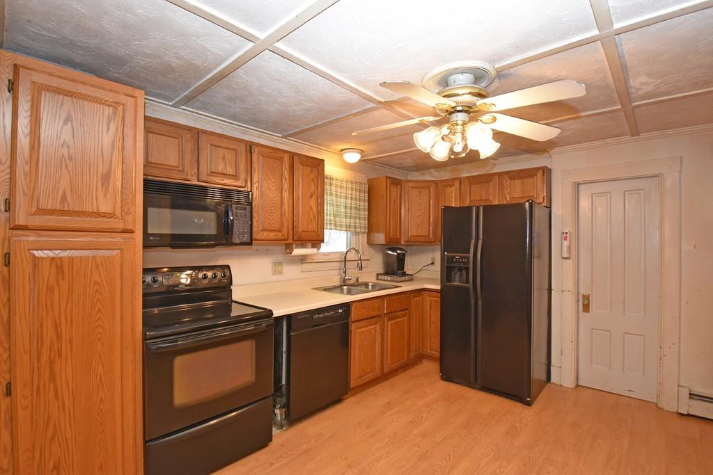 9 Catacunemaug Road Shirley, MA 01464 - Photo 4 of 22 a kitchen with stainless steel appliances granite countertop a refrigerator a stove a sink and dishwasher