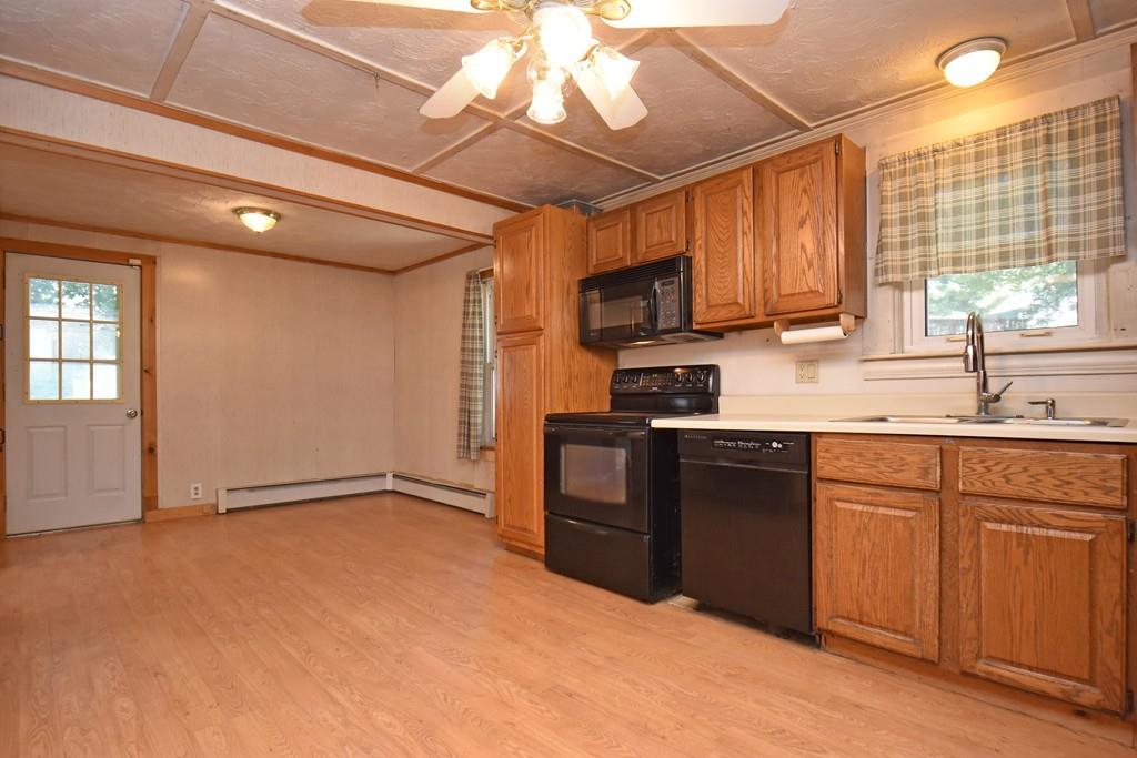 9 Catacunemaug Road Shirley, MA 01464 - Photo 5 of 22 a kitchen with a sink cabinets and window