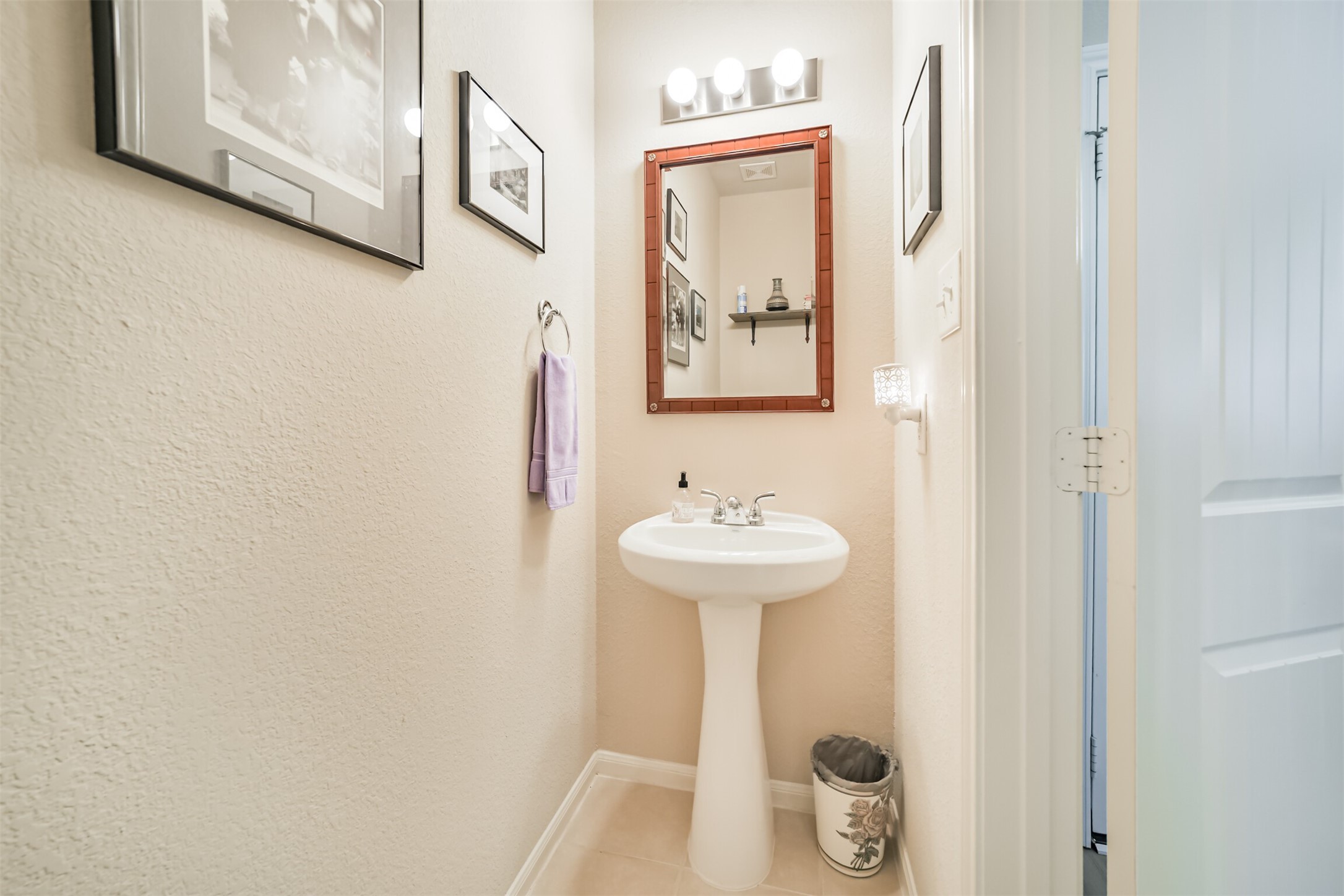 12009 La Salle River Road Conroe, TX 77304 - Photo 12 of 50 a bathroom with a sink and mirror