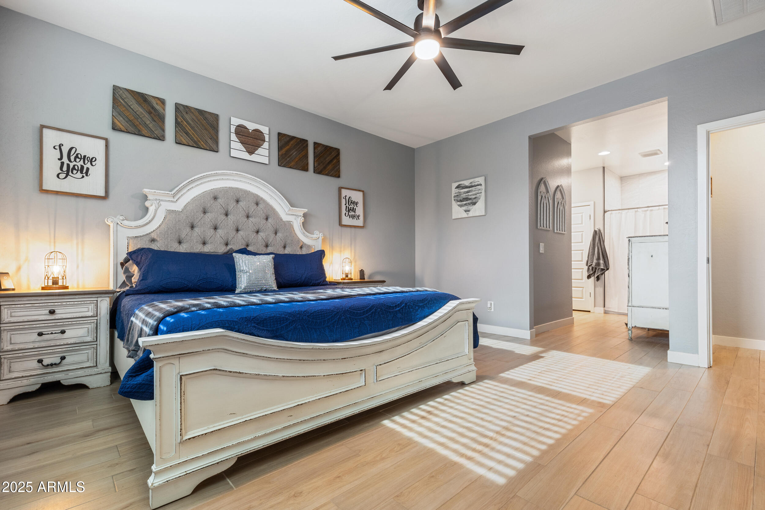 37104 Big Bend Road San Tan Valley, AZ 85140 - Photo 10 of 25 a bedroom with a bed and a chandelier