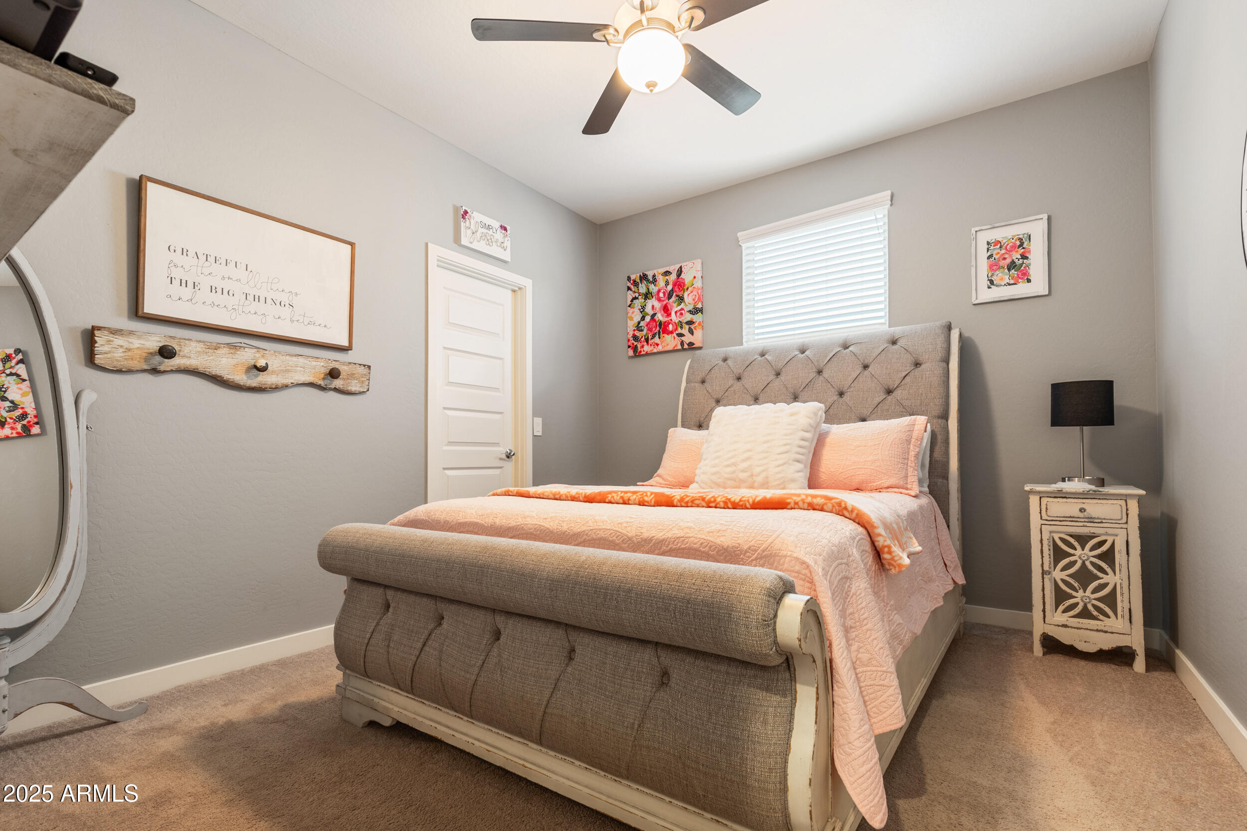 37104 Big Bend Road San Tan Valley, AZ 85140 - Photo 11 of 25 a bedroom with a bed and a chandelier