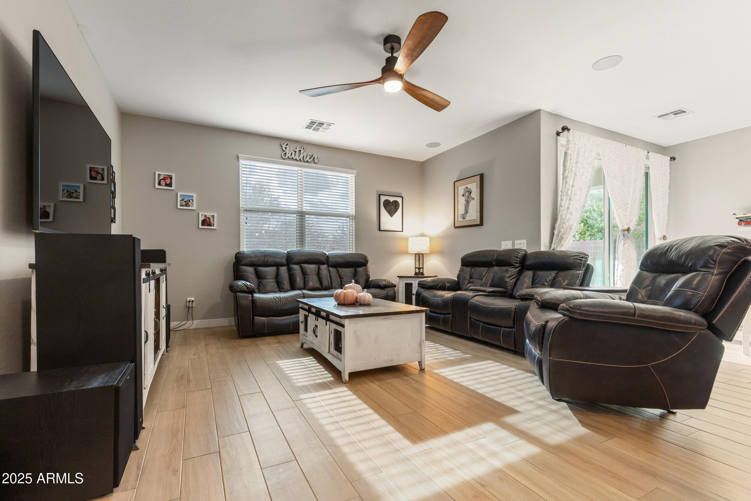 37104 Big Bend Road San Tan Valley, AZ 85140 - Photo 13 of 25 a living room with furniture and a flat screen tv
