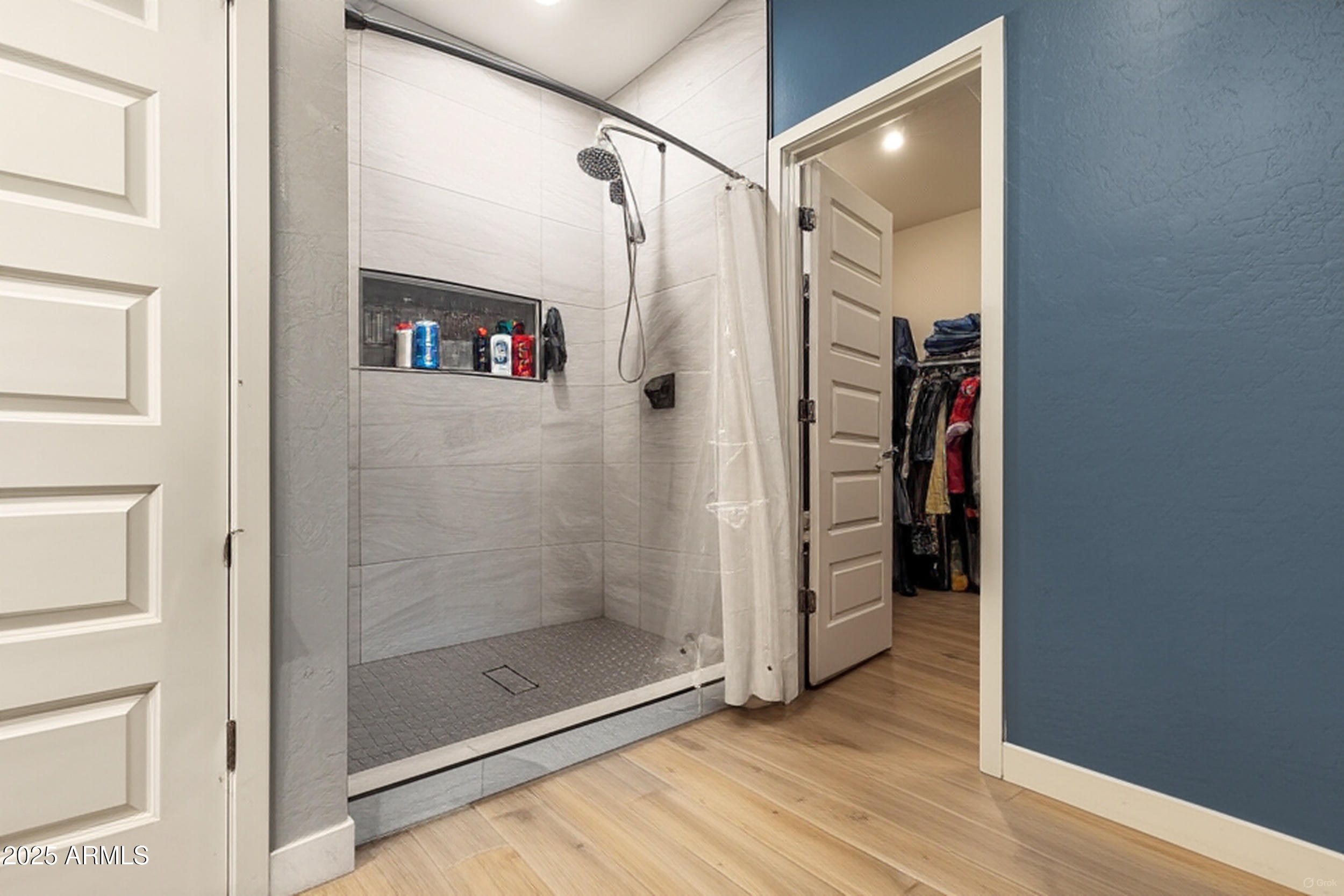37104 Big Bend Road San Tan Valley, AZ 85140 - Photo 14 of 25 a bathroom with a shower and a mirror