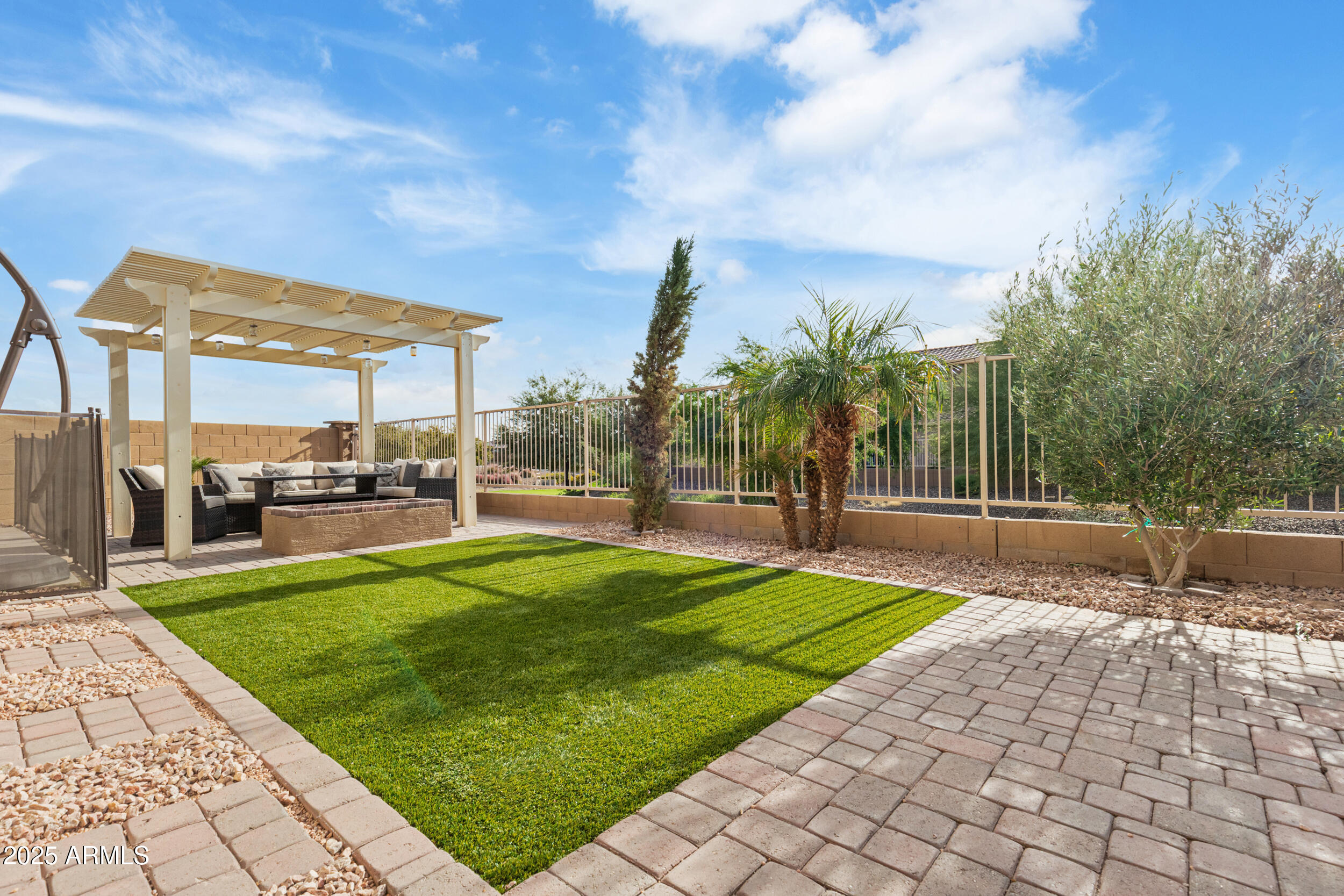 37104 Big Bend Road San Tan Valley, AZ 85140 - Photo 18 of 25 a patio with table and chairs and potted plants