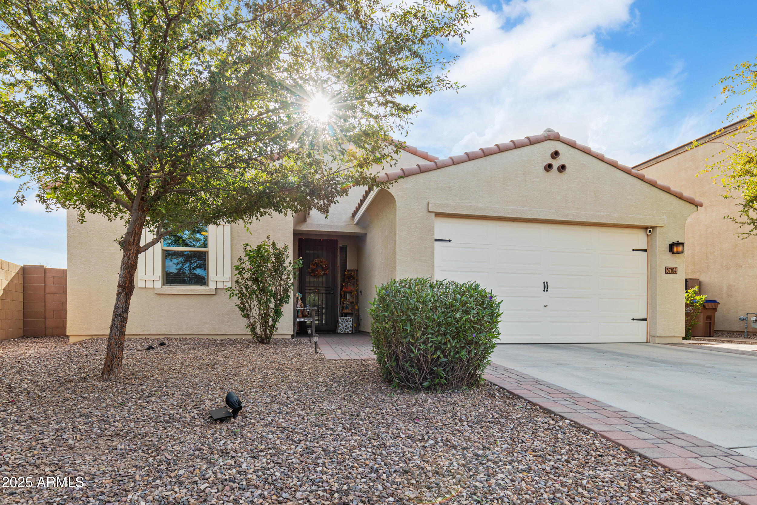 37104 Big Bend Road San Tan Valley, AZ 85140 - Photo 3 of 26 a front view of a house with garden