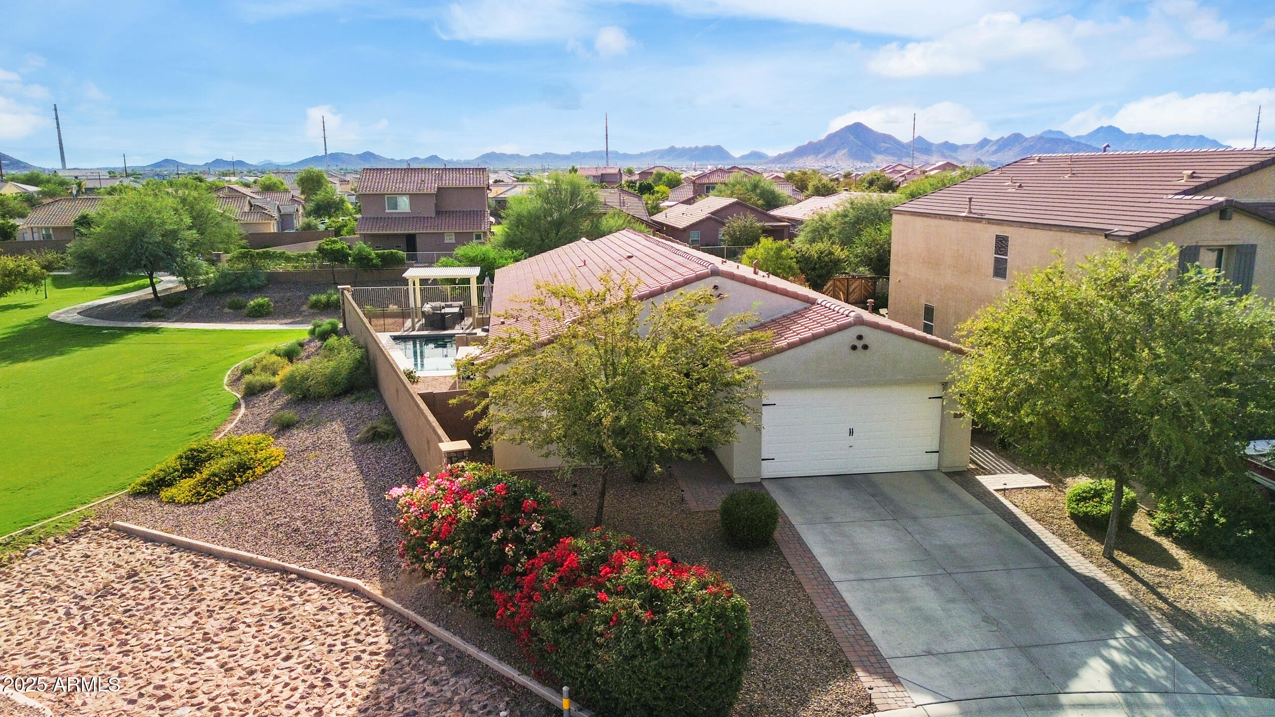 37104 Big Bend Road San Tan Valley, AZ 85140 - Photo 3 of 25 a view of a house with a yard and garden