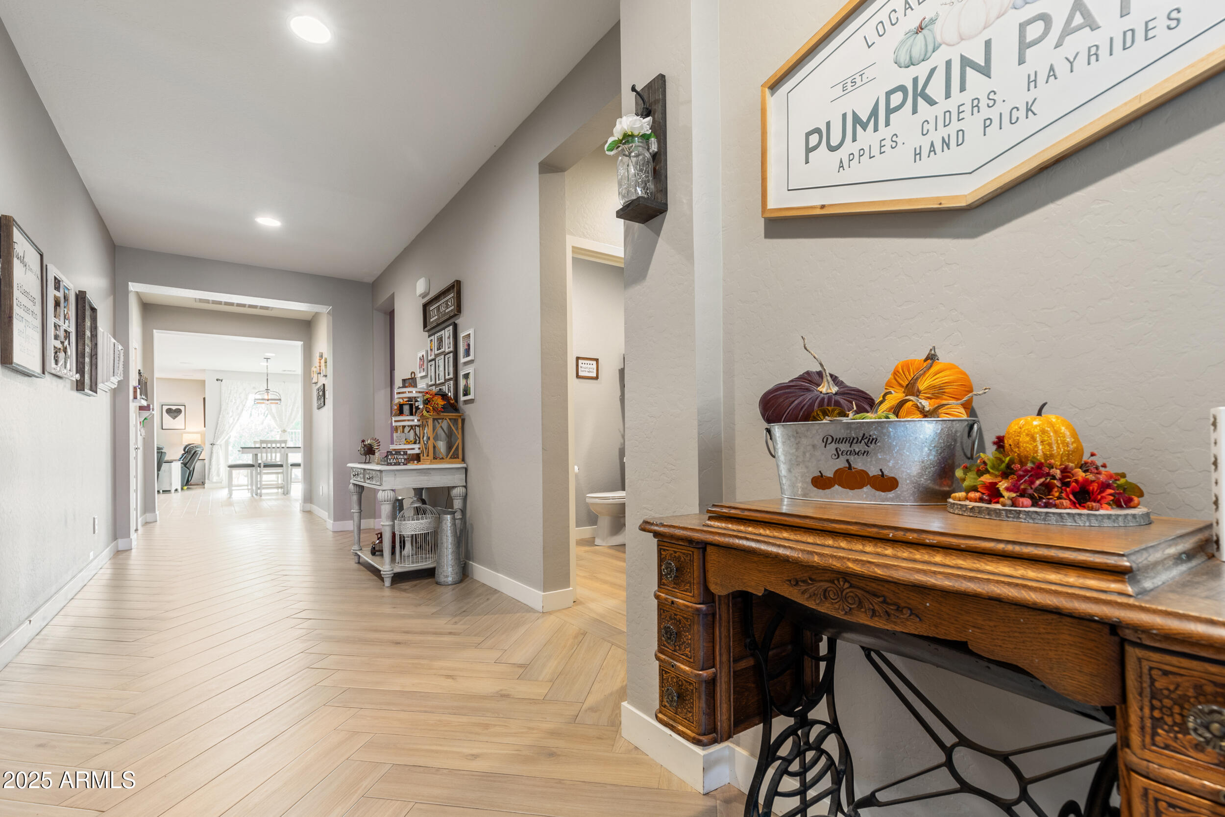 37104 Big Bend Road San Tan Valley, AZ 85140 - Photo 6 of 25 a dining room with furniture and wooden floor