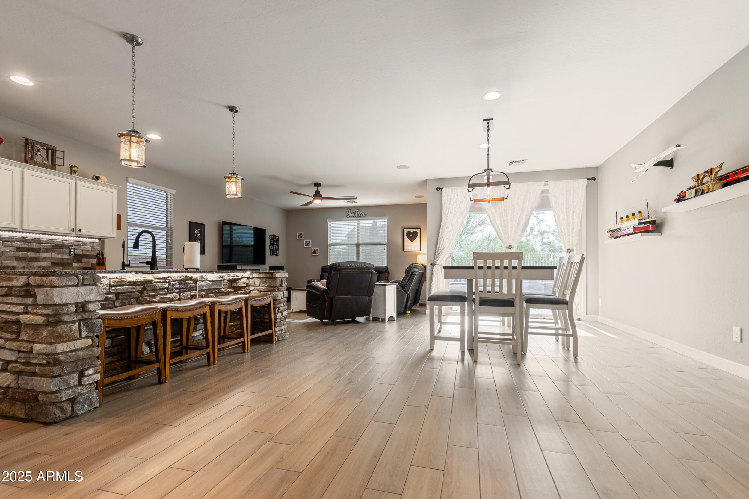 37104 Big Bend Road San Tan Valley, AZ 85140 - Photo 7 of 25 a large kitchen with a table and chairs