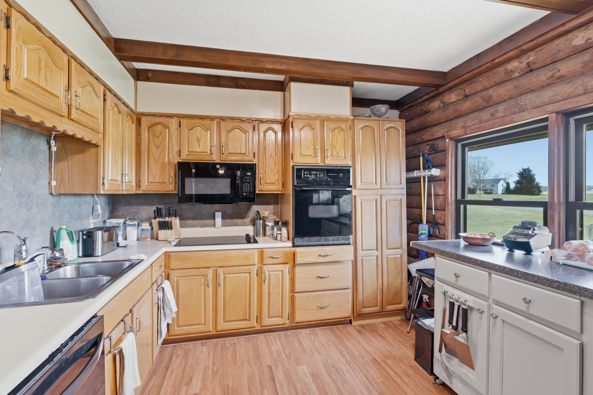 6660 Highland Road Portland, TN 37148 - Photo 16 of 34 a kitchen with a sink appliances cabinets and a large window