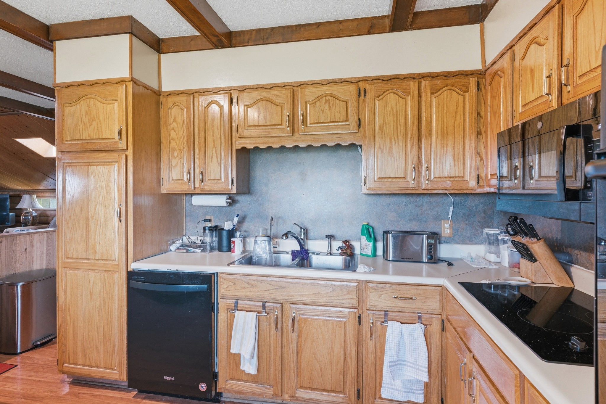 6660 Highland Road Portland, TN 37148 - Photo 17 of 34 a kitchen with stainless steel appliances granite countertop a sink stove refrigerator and cabinets