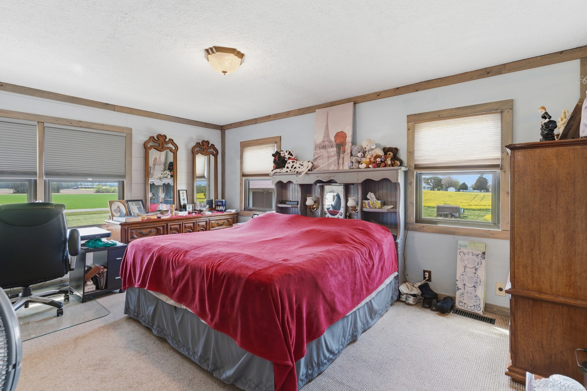 6660 Highland Road Portland, TN 37148 - Photo 23 of 34 a spacious bedroom with a bed and a chandelier