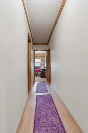 a storage room with lots of wooden furniture