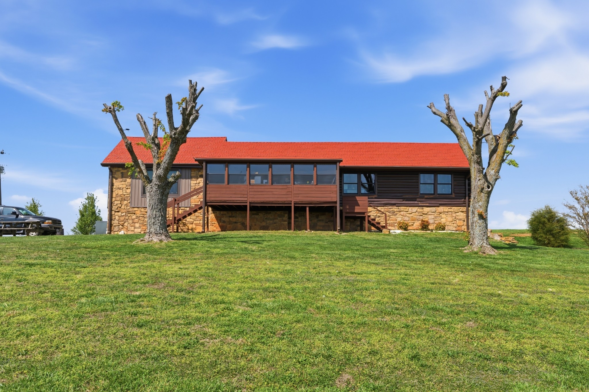 6660 Highland Road Portland, TN 37148 - Photo 3 of 34 a front view of a house with a garden