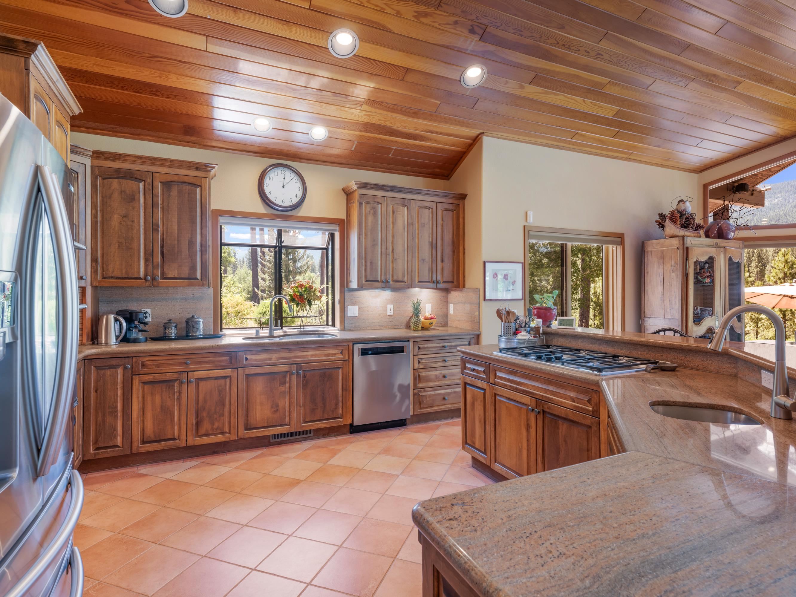 134 Quail View Circle Clio, CA 96106 - Photo 12 of 49 a kitchen with lots of counter top space and appliances