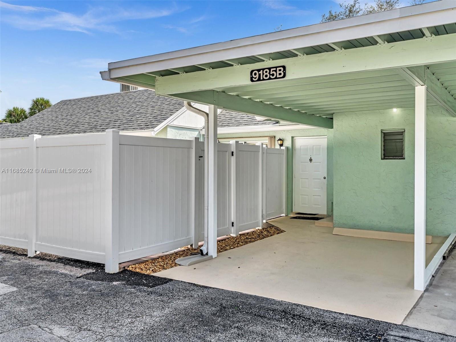 9185 Southwest 5th Street, Unit B Boca Raton, FL 33428 - Photo 1 of 38 a view of a front door