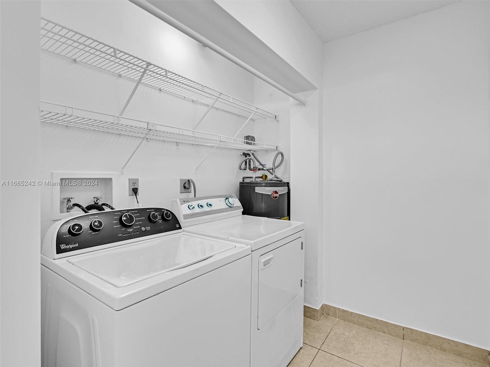 9185 Southwest 5th Street, Unit B Boca Raton, FL 33428 - Photo 11 of 38 a utility room with dryer and washer