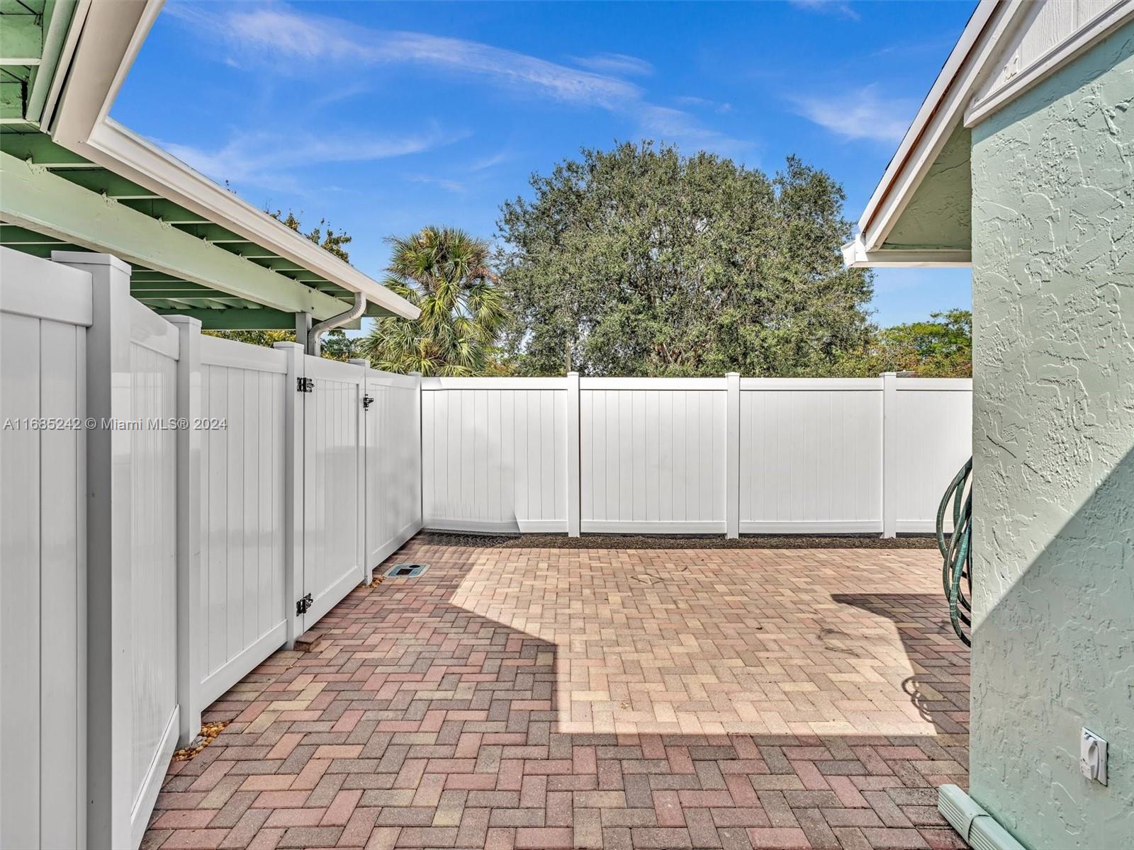 9185 Southwest 5th Street, Unit B Boca Raton, FL 33428 - Photo 28 of 38 a view of a backyard