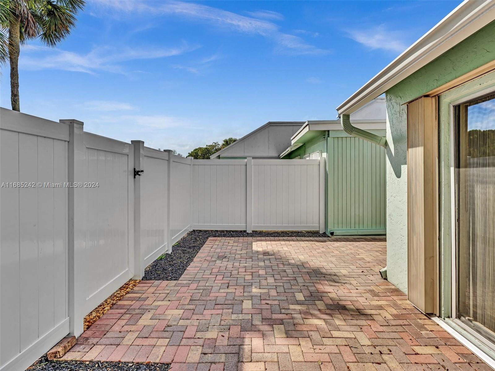 9185 Southwest 5th Street, Unit B Boca Raton, FL 33428 - Photo 30 of 38 a view of a backyard