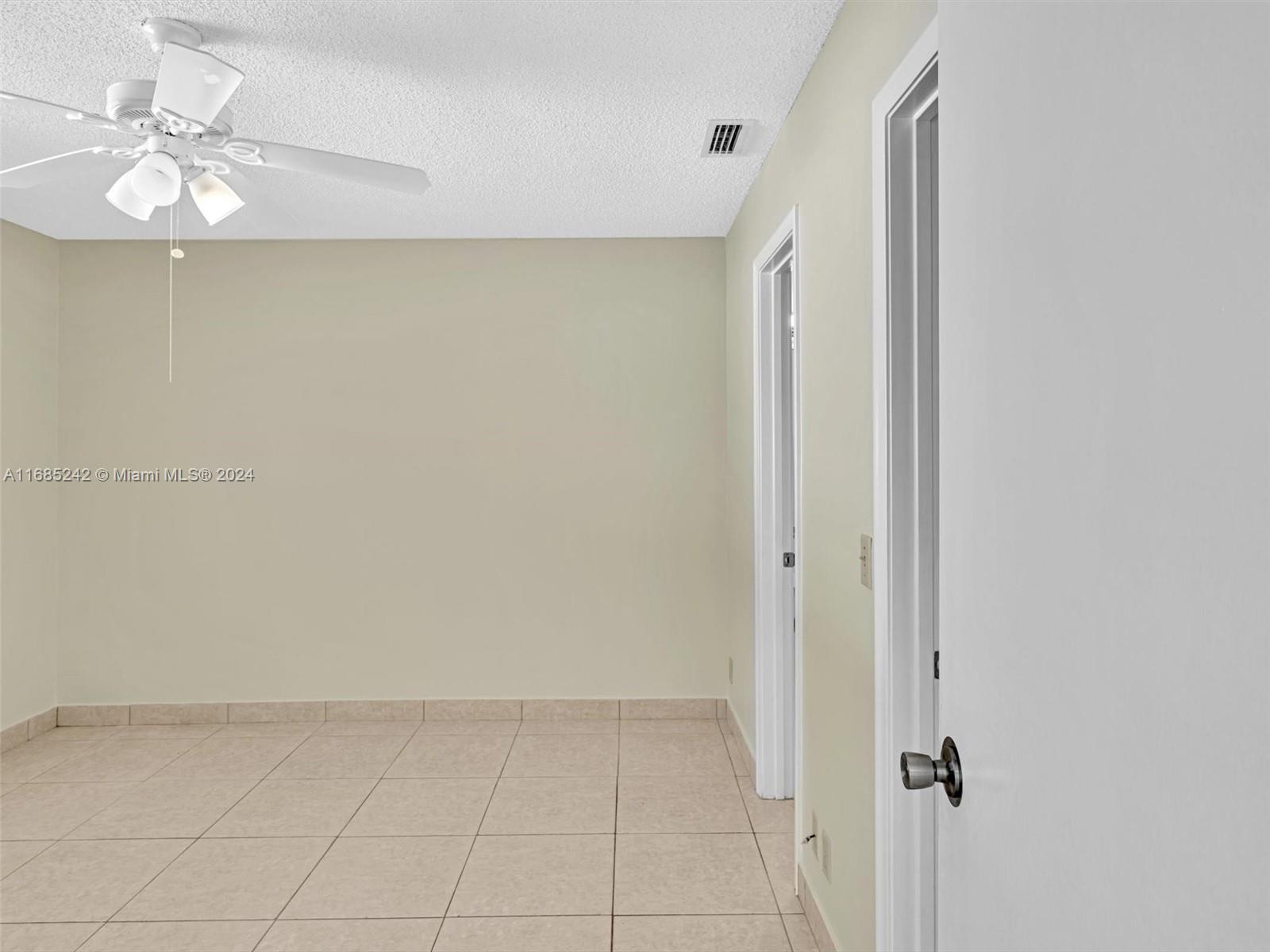 9185 Southwest 5th Street, Unit B Boca Raton, FL 33428 - Photo 3 of 38 a view of an empty room