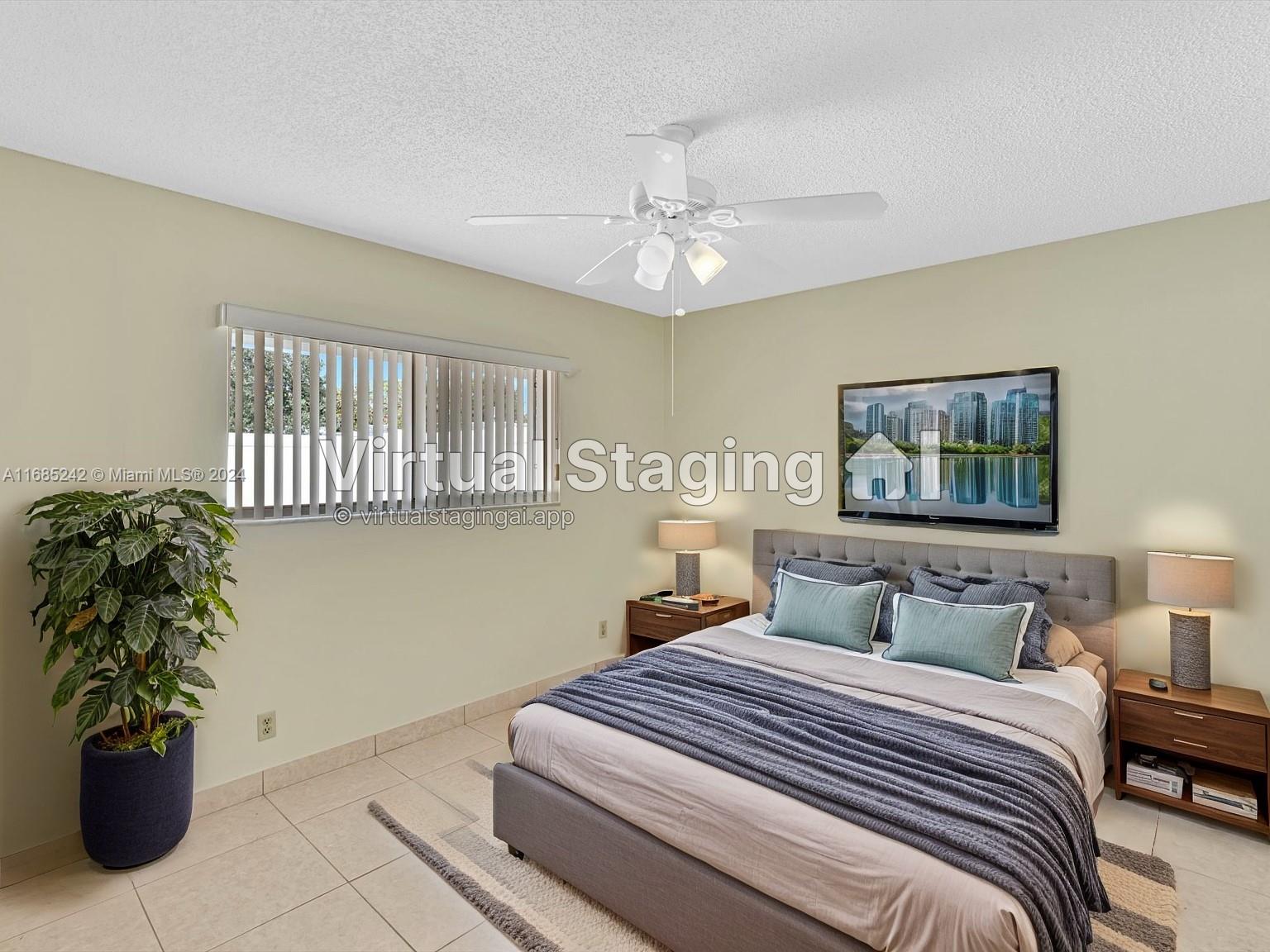 9185 Southwest 5th Street, Unit B Boca Raton, FL 33428 - Photo 35 of 38 a bedroom with a bed and a potted plant