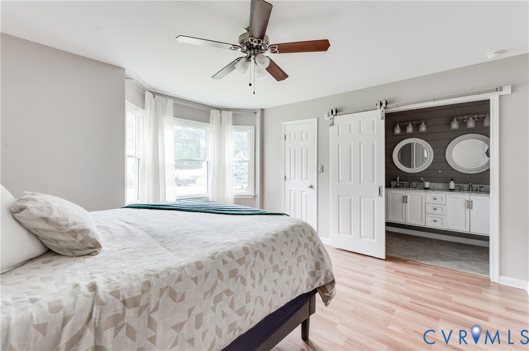 9815 Brenspark Road Chesterfield, VA 23832 - Photo 15 of 38 Spacious primary bedroom showcasing hardwood floor