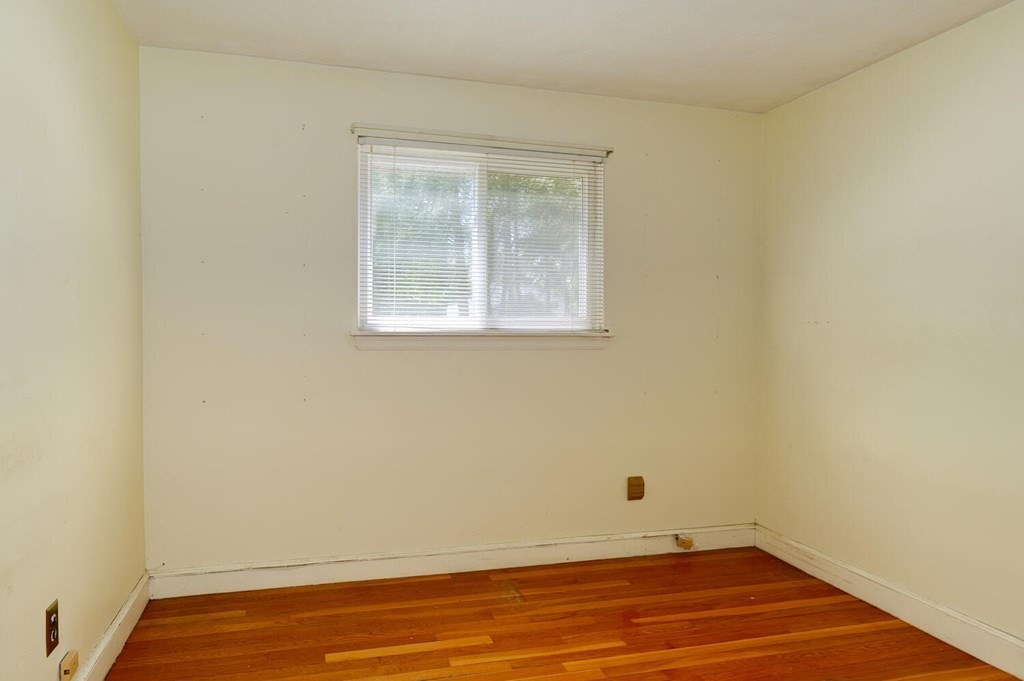 10 Whittemore Road Framingham, MA 01701 - Photo 9 of 19 an empty room with wooden floor and windows