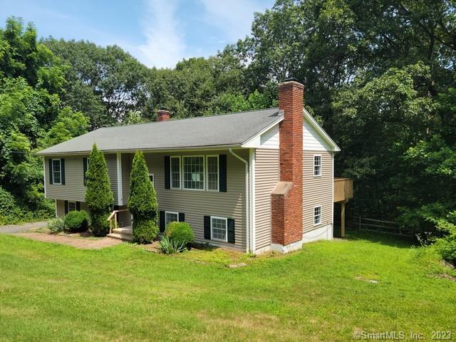 122 Northrop Road Bethany, CT 06524 - Photo 1 of 1 a front view of a house with a yard