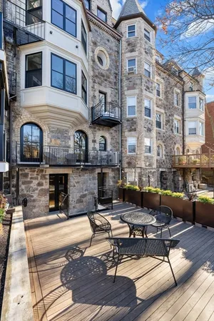 a building outdoor space with patio furniture