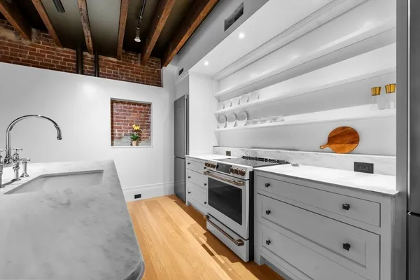 a kitchen with a stove and a sink