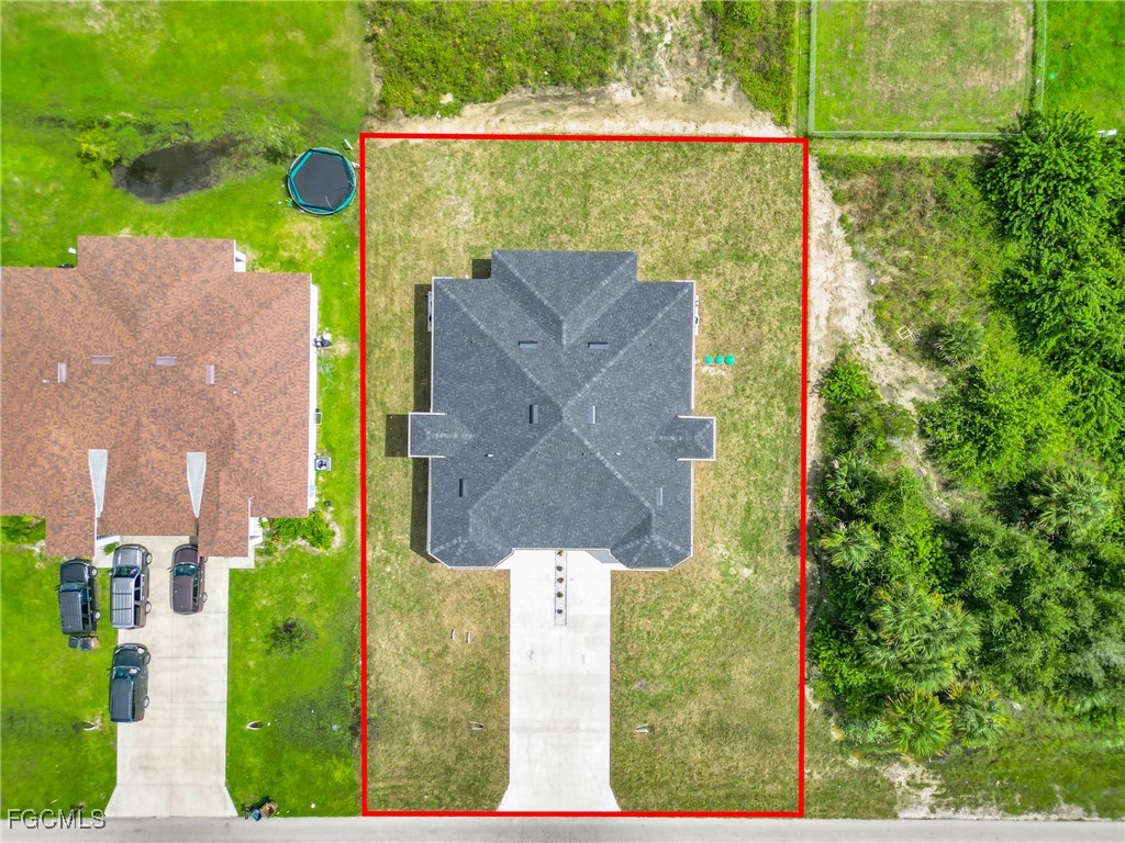 2508-2510 Park Road Lehigh Acres, FL 33971 - Photo 5 of 37 an aerial view of residential house with outdoor space and swimming pool