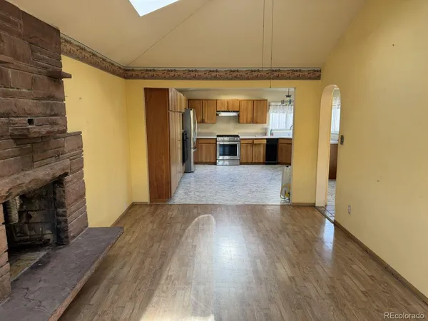 a view of a living room with a fireplace