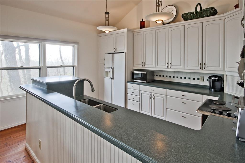 193 Valley View Trail Jasper, GA 30143 - Photo 18 of 61 a kitchen with stainless steel appliances granite countertop a sink a stove and a refrigerator