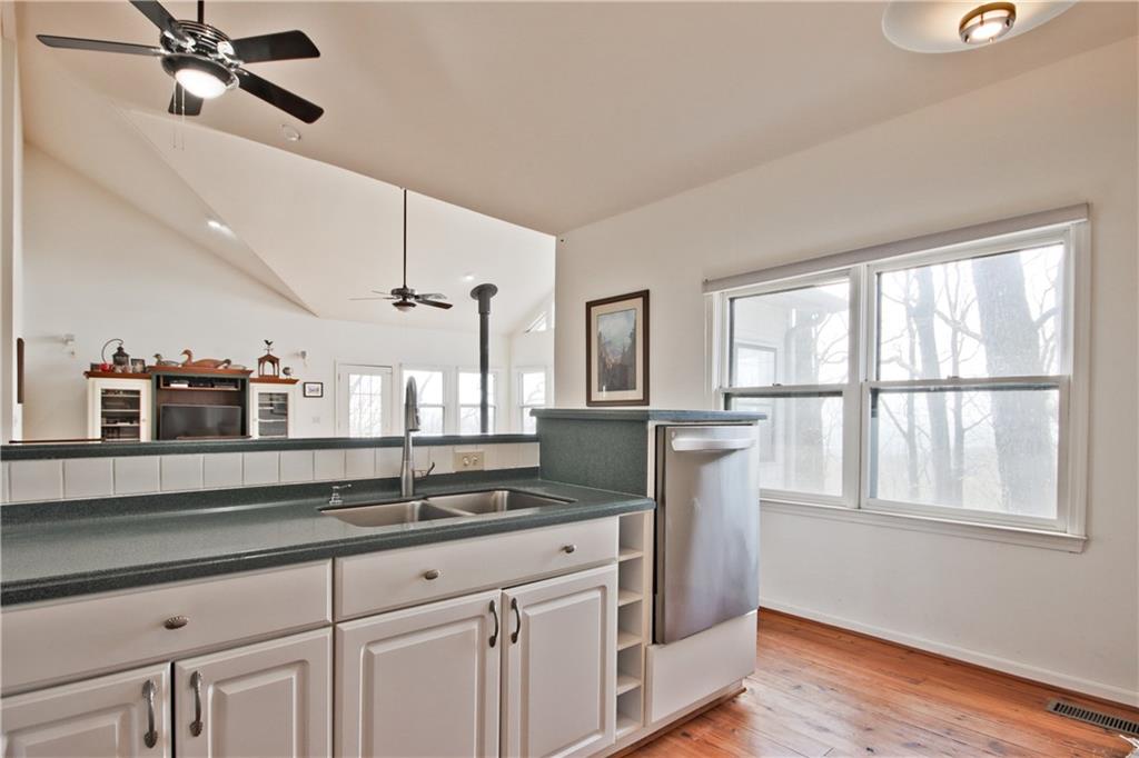 193 Valley View Trail Jasper, GA 30143 - Photo 21 of 61 a kitchen with stainless steel appliances granite countertop a sink a stove and a window