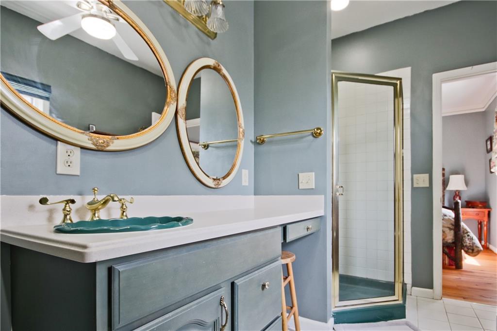 193 Valley View Trail Jasper, GA 30143 - Photo 27 of 61 a bathroom with a sink a mirror and vanity