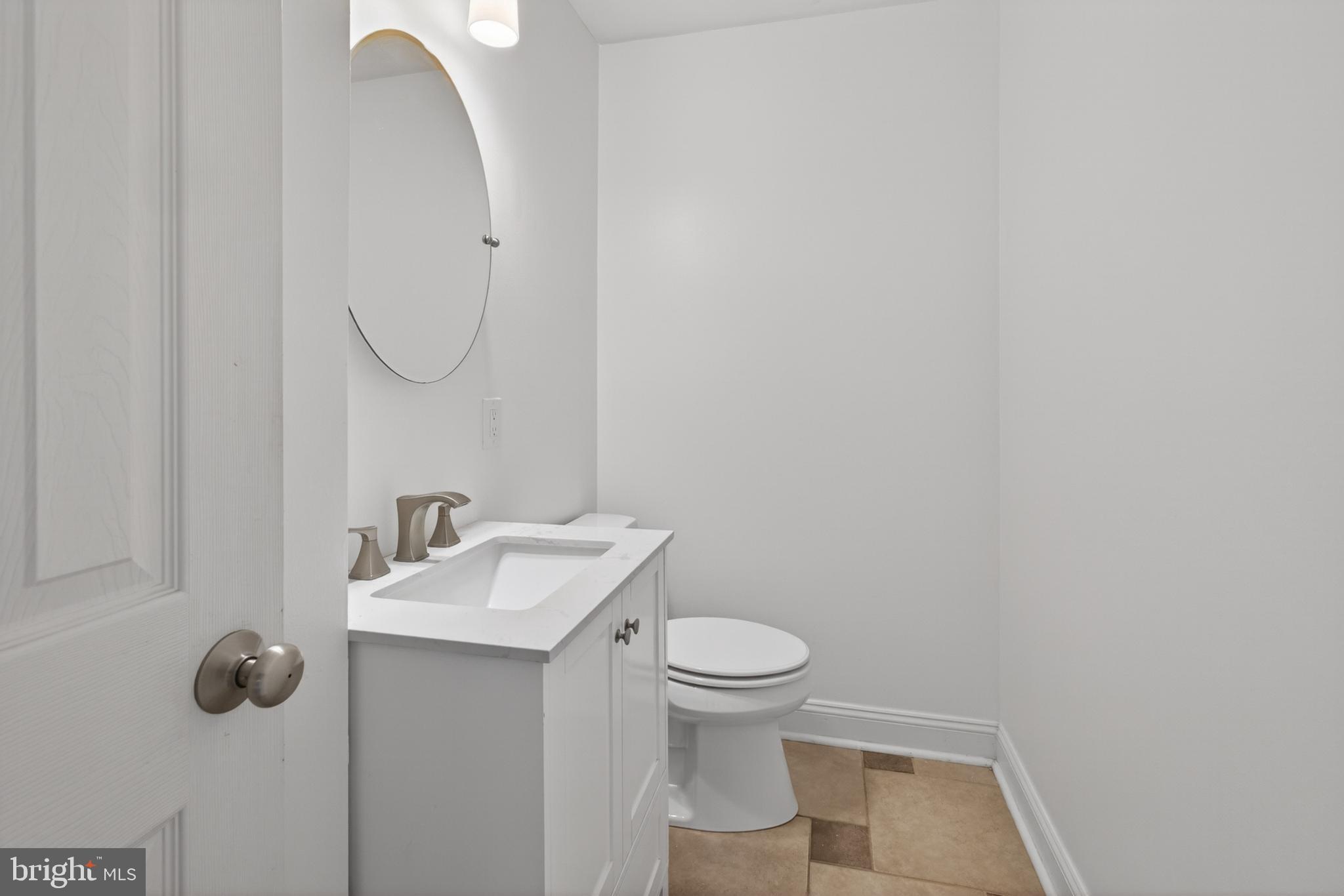 1202 Harbour Ridge Lane Downingtown, PA 19335 - Photo 11 of 37 a bathroom with a sink toilet and mirror
