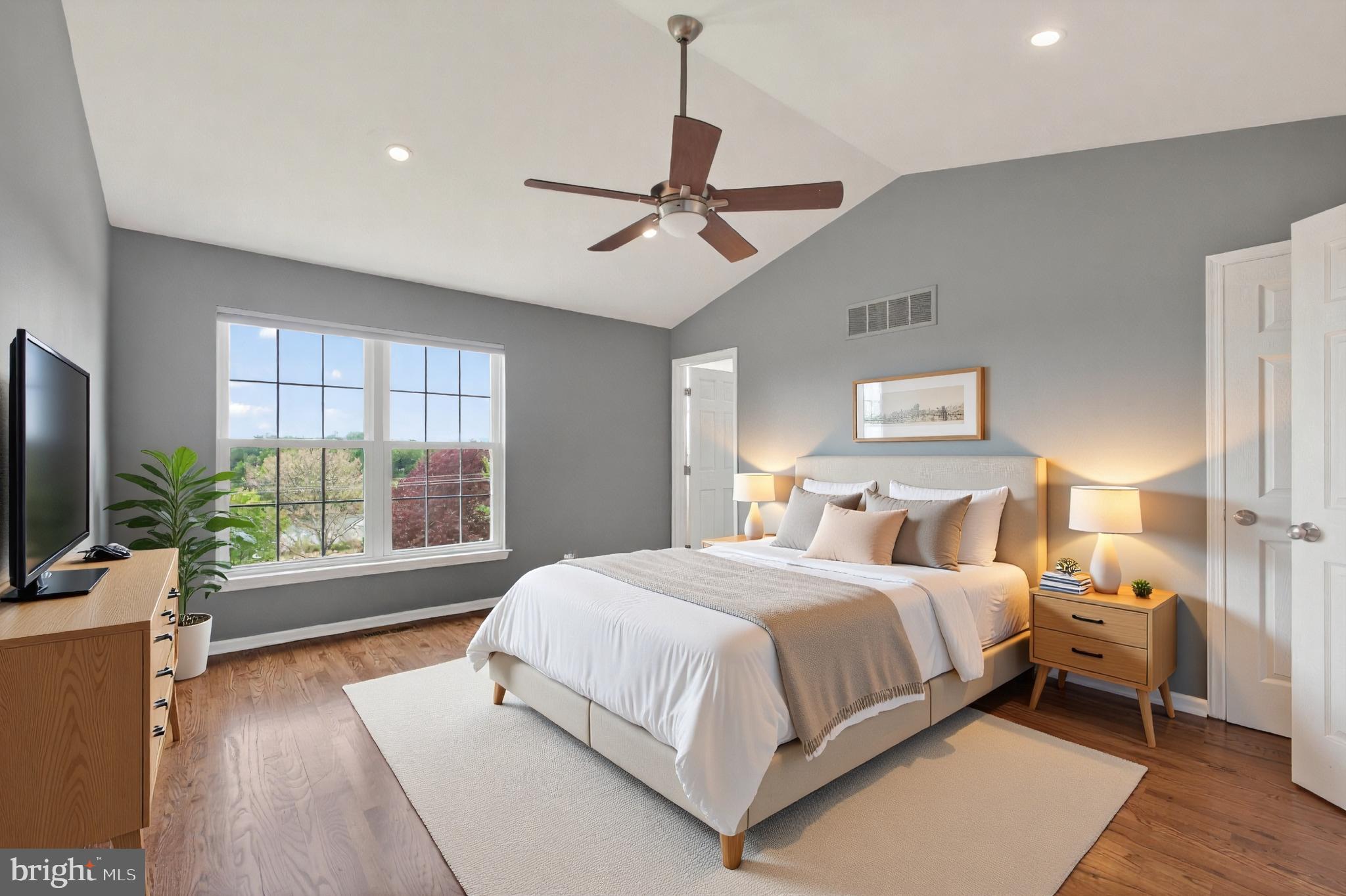 1202 Harbour Ridge Lane Downingtown, PA 19335 - Photo 12 of 37 a bedroom with a large bed and a flat tv screen