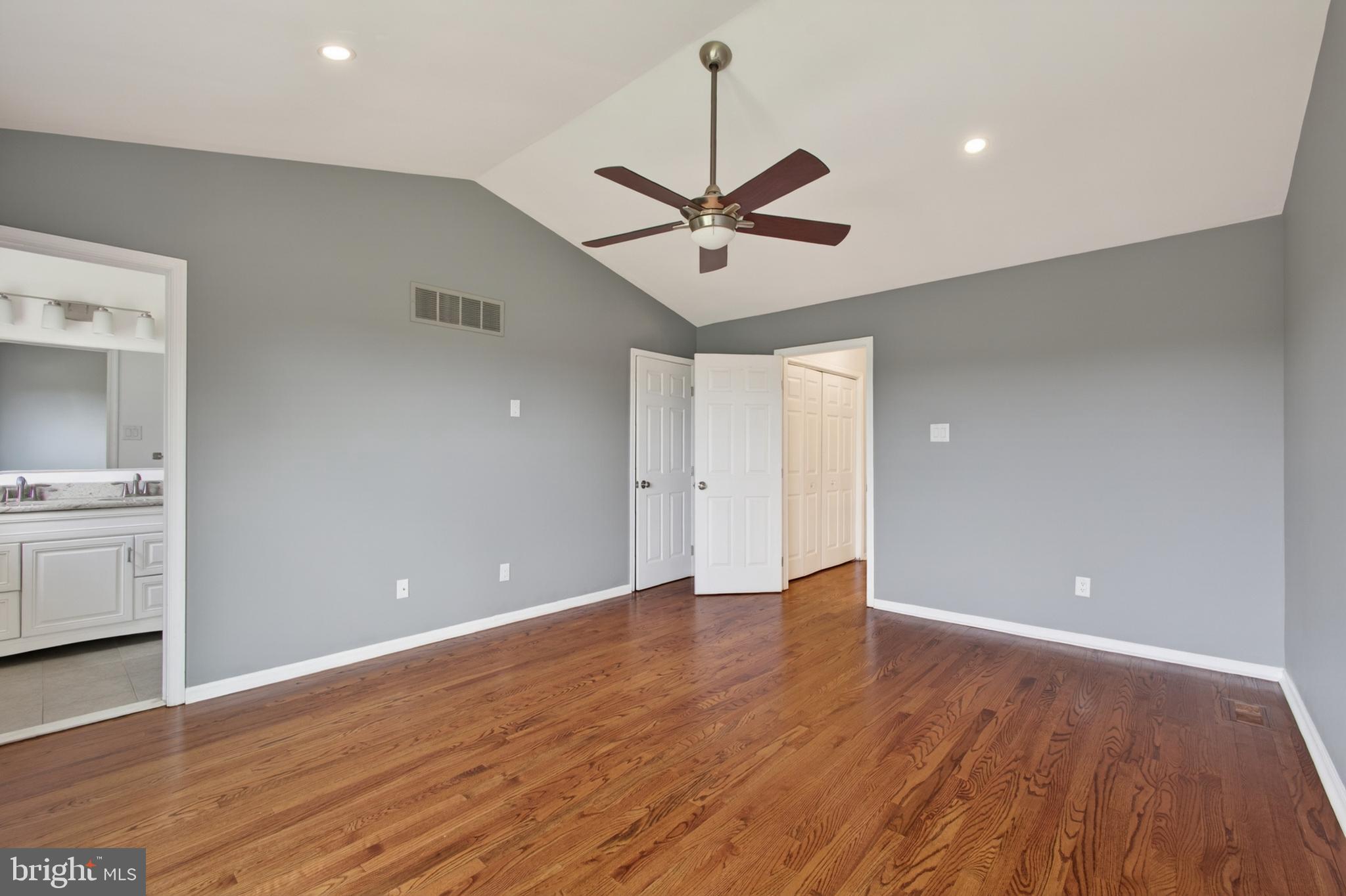 1202 Harbour Ridge Lane Downingtown, PA 19335 - Photo 14 of 37 a view of an empty room with a window and wooden floor