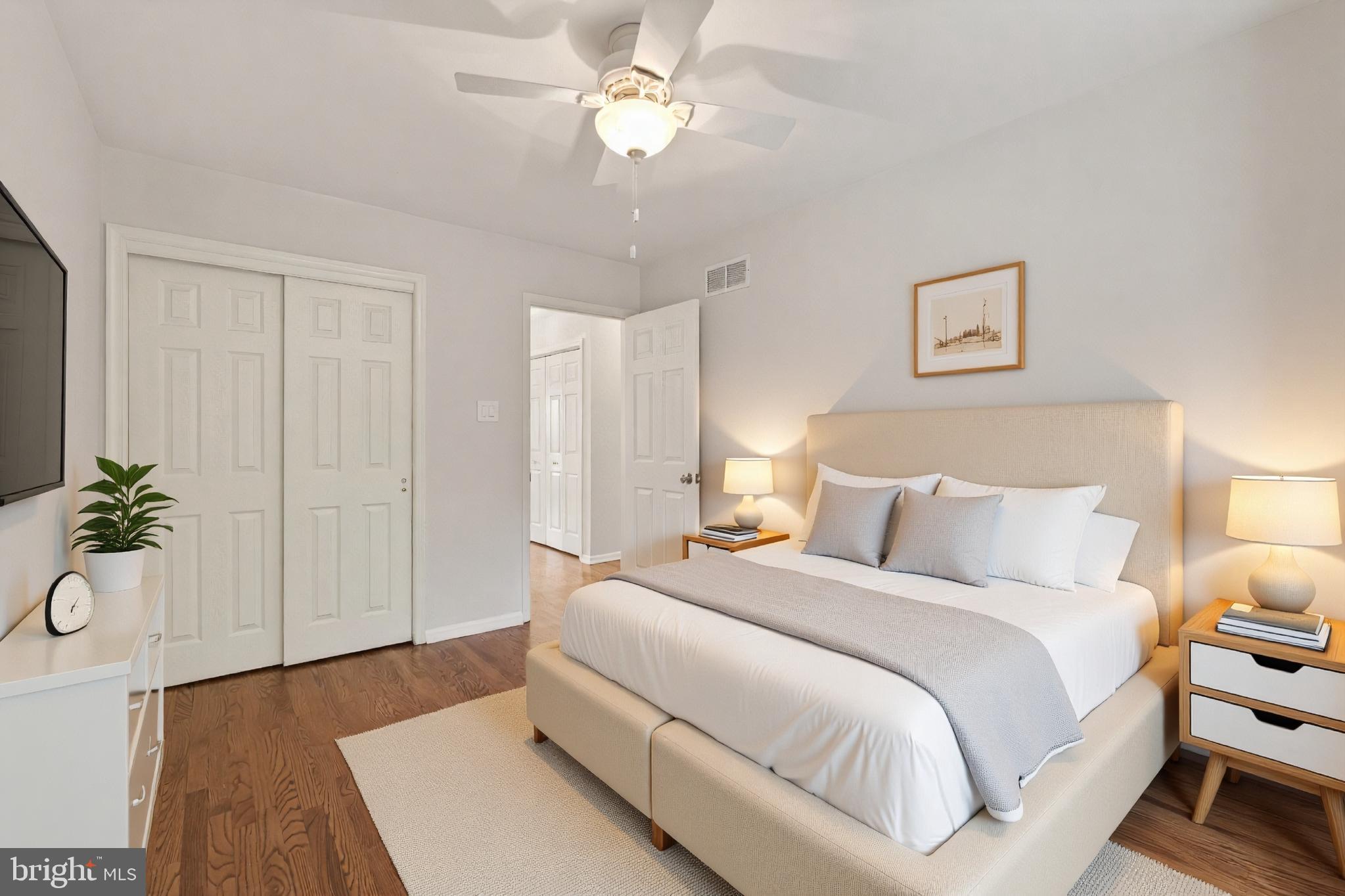 1202 Harbour Ridge Lane Downingtown, PA 19335 - Photo 17 of 37 a bedroom with a large bed and a chandelier