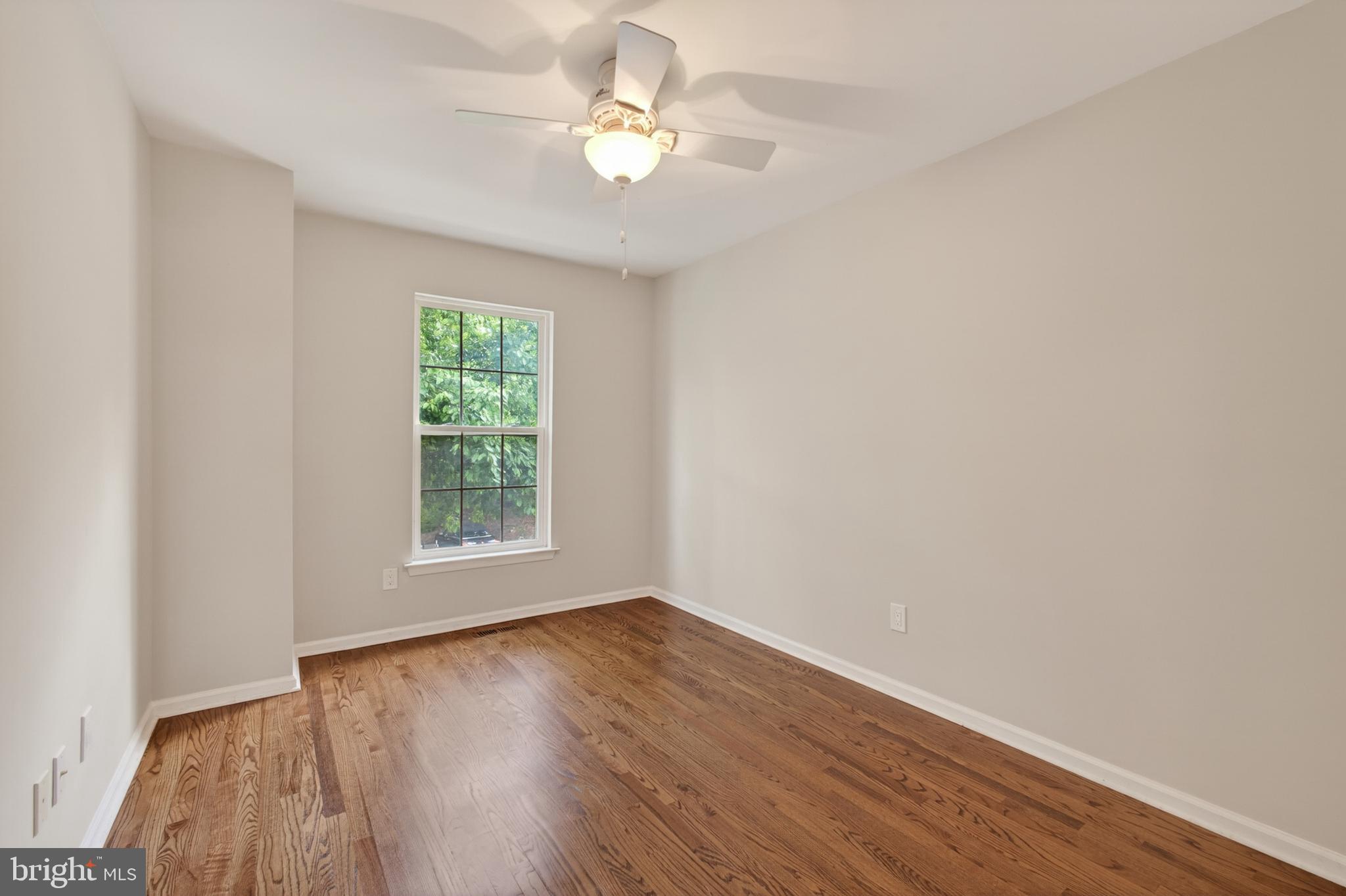 1202 Harbour Ridge Lane Downingtown, PA 19335 - Photo 19 of 37 wooden floor in an empty room with a window